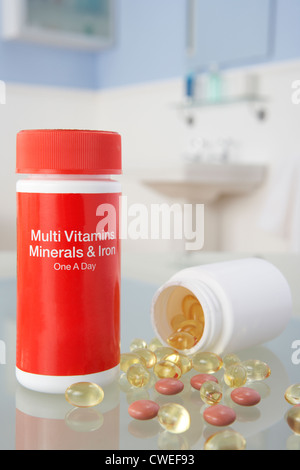 Vitamin pills on bathroom shelf Stock Photo