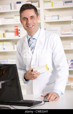 American pharmacist working on computer Stock Photo