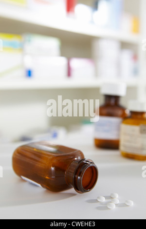 Prescription pill bottles on pharmacy shelf Stock Photo