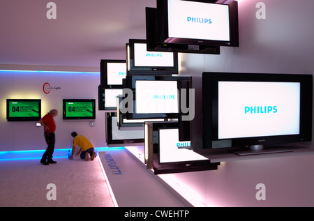 Flat screens made by Philips at the IFA trade fair stand against a wall Stock Photo