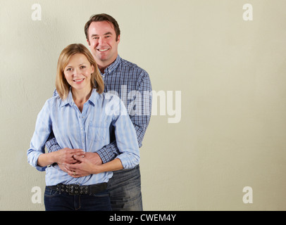 Studio Shot Of Relaxed Middle Aged Couple Stock Photo