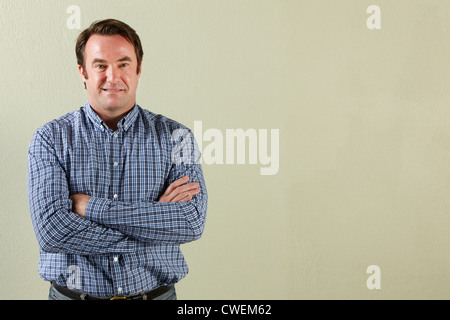 Studio Shot Of Relaxed Middle Aged Man Stock Photo