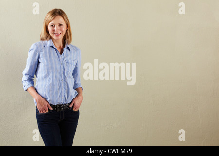 Studio Shot Of Relaxed Middle Aged Woman Stock Photo