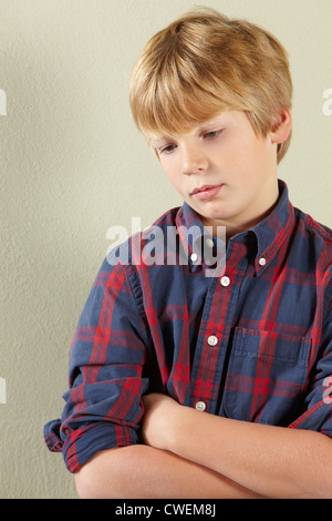 Studio Shot Of Thoughtful Young Boy Stock Photo