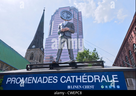 Mannequin with clock head at Les Promenades de la Cathédrale in downtown Montreal. Stock Photo