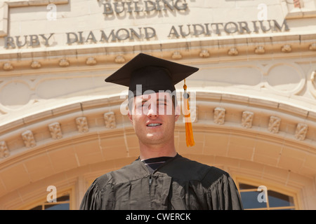 Recent FSU graduate poses in front of the Westcott Building on the Campus of Florida State University in Tallahassee, Florida. Stock Photo