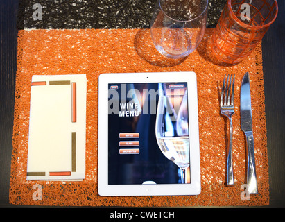 A restaurant menu on iPADs.  The page selected is the homepage for the wine menu. Stock Photo