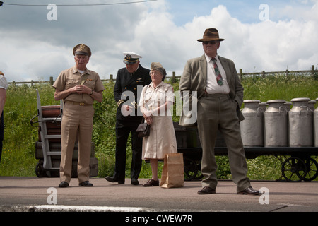 US Military personnel and civilian on railway platform Stock Photo