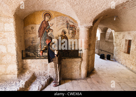 Christian Pilgrim visiting Our Lady of Saidnaya convent near Damascus, Syria. Both Muslim and Christian pilgrims come to venerate the Virgin Mary icon Stock Photo