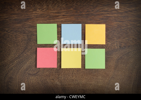 Colorful sticky notes on wooden background Stock Photo