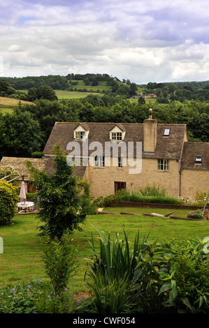A modern detached home built in Cotswold stone England UK Stock Photo