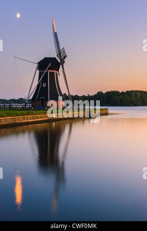 Windmill De Helper at Paterswoldsemeer just after sunset, near Haren in the Province of Groningen, Netherlands Stock Photo