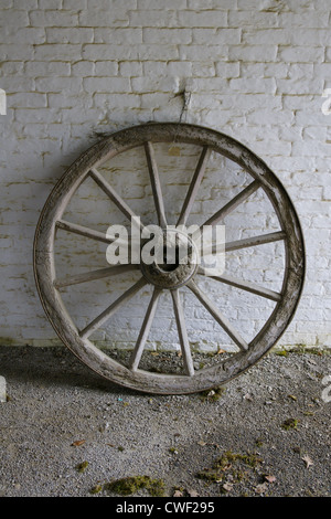 Cartwheel as would have been used on a cart or wagon or coach in days gone by Stock Photo
