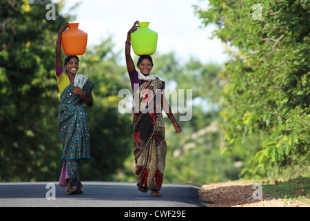 Indian women carrying water Andhra Pradesh South India Stock Photo