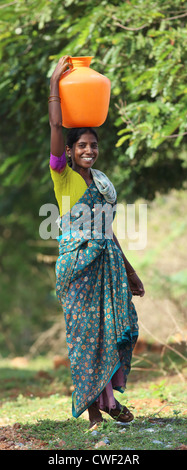 Indian women carrying water Andhra Pradesh South India Stock Photo