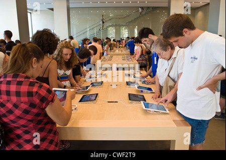 Interior of the Apple Store with customers browsing ipads in Barcelona, Catalonia, Spain, ES Stock Photo