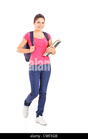 Full length portrait of a female student holding books isolated on white Stock Photo