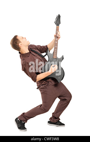 Full length portrait of a rock star playing guitar isolated on white Stock Photo