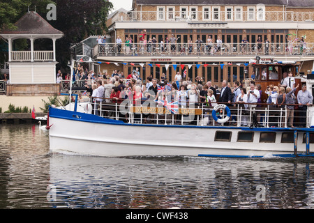 Yarmouth Belle follows the 2012 Olympic Flame on Royal Boat Gloriana. Stock Photo