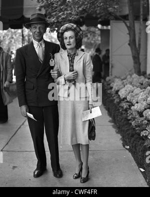 Fred Astaire, famed dancer, singer and actor, with wife Phyllis at Belmont Park, NY 1951 Stock Photo