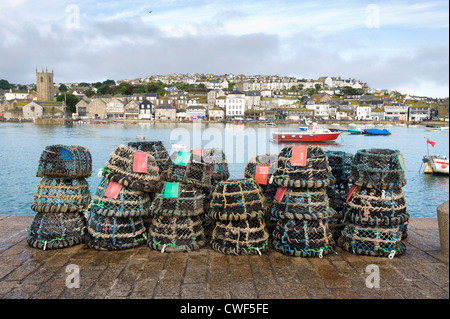 lobster or crab pots on the harbour wall at st ives cornwall Stock Photo