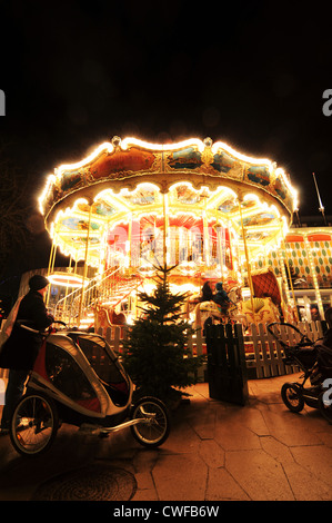 Copenhagen, Denmark - 18 Dec, 2011: Night view of carousel in Tivoli Gardens Stock Photo