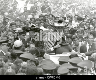 The Apollo 11 astronauts, Neil A. Armstrong, Edwin E. Aldrin, Jr., and Michael Collins, wearing sombreros and ponchos, are swarmed by thousands in Mexico City as their motorcade is slowed by the enthusiastic crowd September 23, 1969 in Mexico City, Mexico. The GIANTSTEP-APOLLO 11 Presidential Goodwill Tour carried the Apollo 11 astronauts and their wives to 24 countries and 27 cities in 45 days. Stock Photo