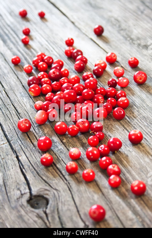fresh red berries on wooden table Stock Photo