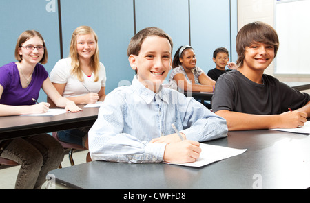 Diverse group of middle-school children in class.  Stock Photo