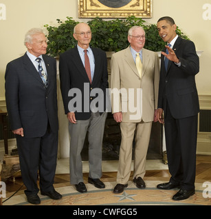 President Barack Obama chats with Apollo 11 astronauts, from left, Buzz Aldrin, Michael Collins and Neil Armstrong in the Oval Office of the White House on the 40th anniversary of the Apollo 11 lunar landing July 20, 2009 in Washington, DC. Stock Photo