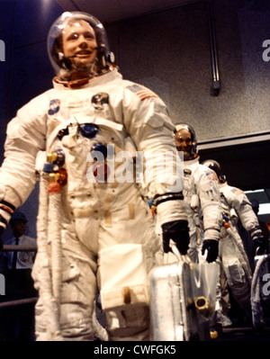 NASA Commander Neil A. Armstrong leads astronauts Michael Collins and Edwin E. Aldrin Jr. from the Manned Spacecraft Operations Building to the transfer van for the eight-mile trip to Pad 39A to enter their Apollo 11 spacecraft July 16, 1969 at the Kennedy Space Center, Florida. The crew is scheduled for lift-off on the first manned mission to the surface of the moon. Stock Photo