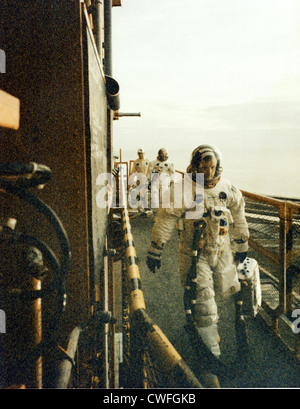 NASA Astronauts Neil A. Armstrong (front) and Edwin E. Aldrin Jr. walk across the mobile launcher to enter their Apollo 11 spacecraft July 16, 1969 at the Kennedy Space Center, Florida. The crew is scheduled for lift-off on the first manned mission to the surface of the moon. Stock Photo