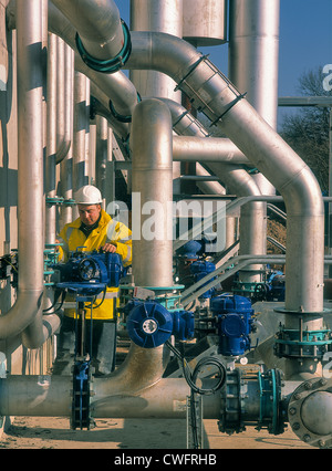 Engineer working on pipework at Framlingham Sewage Treatment Works. Stock Photo