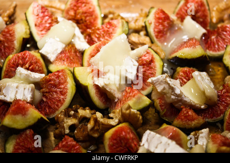 Baked figs with goat cheese and walnuts Stock Photo