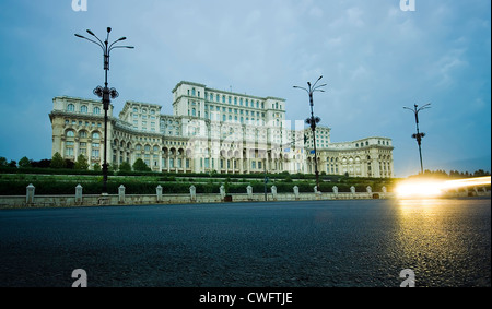 The Palace of the Parliament in Bucharest, Romania and car lights on road Stock Photo