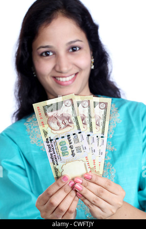 Smiling woman holding Indian currency notes Stock Photo