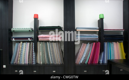 Fabric Display In Rows Linen cotton fabric clothes display on shelfs in shop Stock Photo - Alamy
