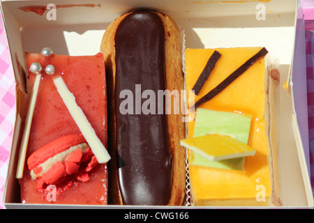 Close-up of a Framboisine cake, an eclair, and a passion-fruit gateau Stock Photo