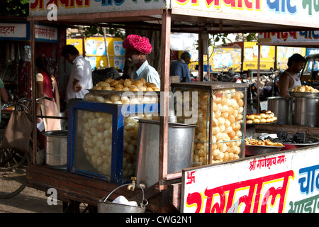 Street Food Vendor Selling Indian Pakoras, and Snacks Stock Photo