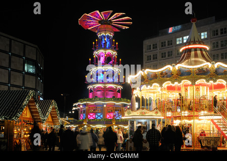 Christmas market with merry-go-round and Christmas pyramid from Erzgebirge, Ore Mountains, Alexanderplatz square, Berlin Stock Photo