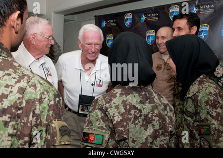 KABUL, Afghanistan -- (August 16, 2011) Former Astronaut Gene Cernan leans in to hear a question from a female Afghan Air Force candidate during a meet and greet at Camp Eggers, Kabul, Aug. 16, home of the NATO Training Mission - Afghanistan. Neil Armstrong, Cernan and Jim Lovell spoke to the small group of AAF students during the United Service Organization’s Living Legends of Aerospace tour Stock Photo