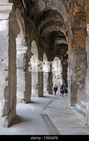 Arches under Roman amphitheatre or arena Nimes France showing barrel vaulting Stock Photo