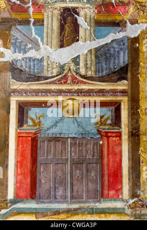 Frescos at the Villa di Poppaea at the Roman site of Oplontis, a resort, depicting gates and columns in perspective. Stock Photo