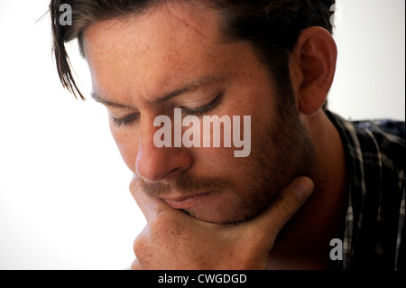Young man working thinking Stock Photo