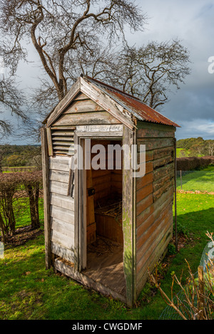 Run down Old typical Australian toilet/outhouse. Stock Photo