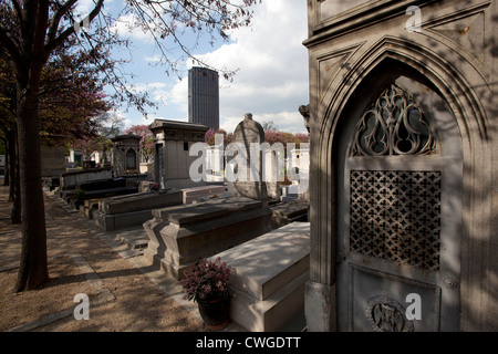 Montparnasse cemetery, Paris, France with Tour Montparnasse in the background Stock Photo