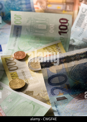 Euromuenzen on disarranged euro notes in various denominations Stock Photo