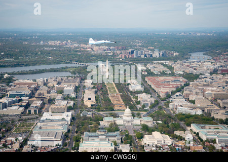 A NASA T-38 training jet is seen as it flies over Washington, DC, April 5, 2012. NASA, in cooperation with the Federal Aviation Administration, conducted training and photographic flights over the DC metropolitan area. T-38 aircraft have been used for astronaut training for more than 30 years as they allow pilots and mission specialists to think quickly in changing situations, mental experiences the astronauts say are critical to practicing for the rigors of spaceflight. Stock Photo