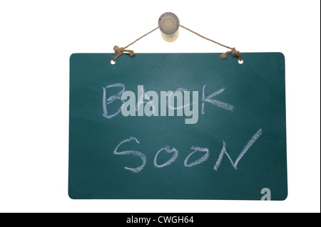 Back soon words on green board isolated on white background Stock Photo
