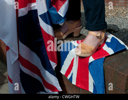 feet of Olympic supporters on union jack Stock Photo